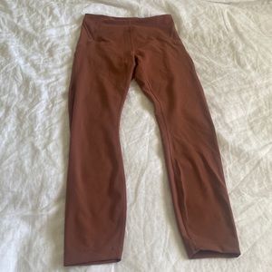 In still lululemon leggings in a dark mauve color size 6